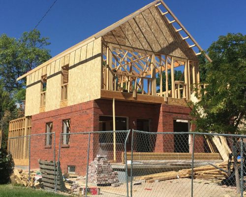 ArcWest Architects Residential Addition Pontiac - progress - trusses up